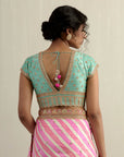 Powder Pink Moonga Silk Saree With A Sky Blue Blouse