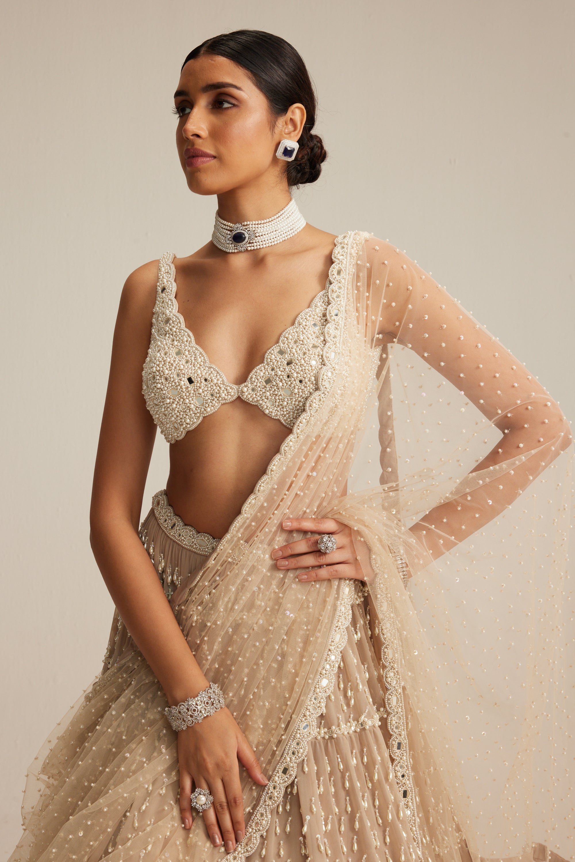 Light Beige Pearl Drop Multi Tier Lehenga Set.