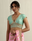 Powder Pink Moonga Silk Saree With A Sky Blue Blouse
